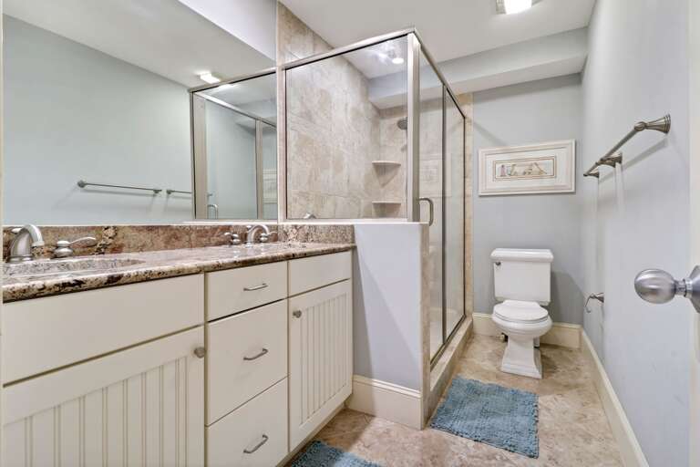 Double sinks and walk-in shower in this spacious, updated master bathroom