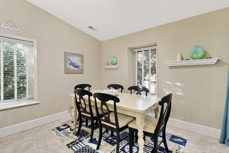 Updated dining room furniture comfortably seats six.   