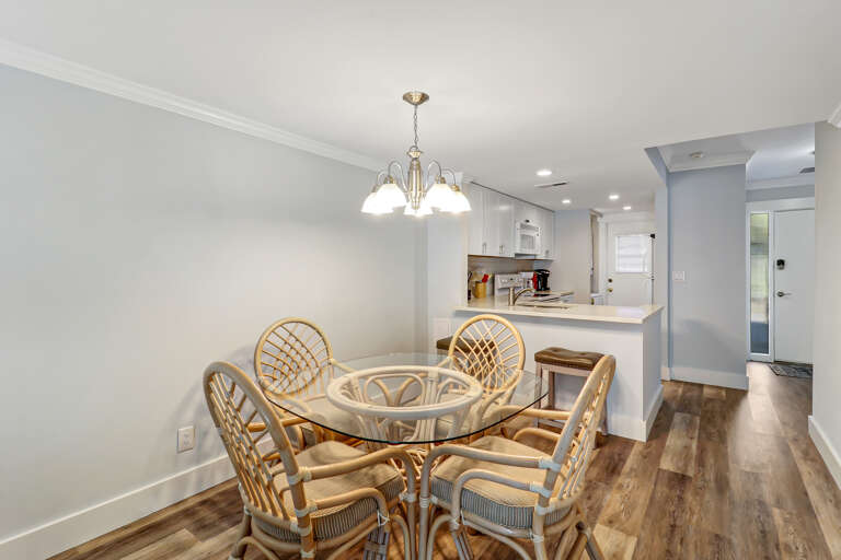 The newly renovated completely furnished Kitchen features all stainless steel appliances, beautiful granite counters.  Dining table seats four. 