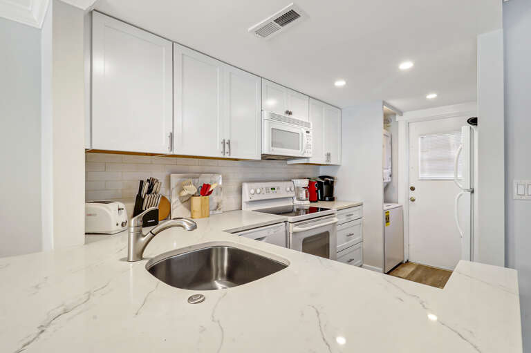 The newly renovated completely furnished Kitchen features all stainless steel appliances, beautiful granite counters.  Dining table seats four. 