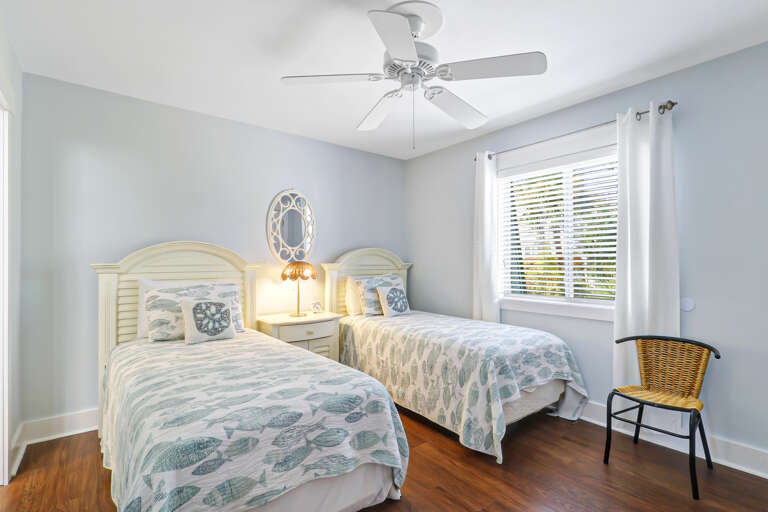 This cute guest bedroom sleeps two comfortably with plenty of space in the closets to store luggage and clothing.