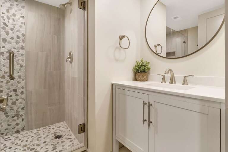 Another beautiful  bright and light renovated bathroom with walk-in shower. 