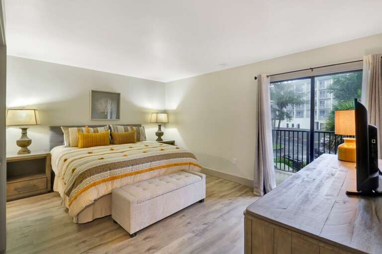 Beautiful renovated bedroom with king sized bed and private balcony. 