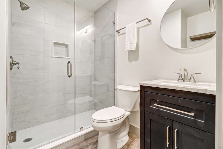 Renovated bathroom with walk-in shower
