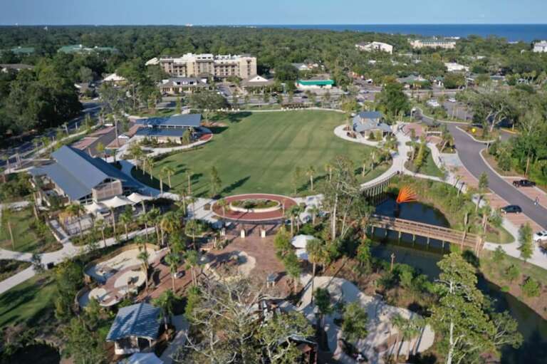 Aerial View Of Resort Area With Recreational Facilities And Landscaped Gardens