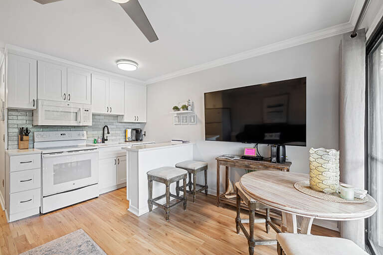 Interior Of A Kitchen With Dining Area And Television