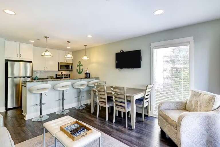 Interior Of A Residential Living Space With Kitchen, Dining Area, And Lounge