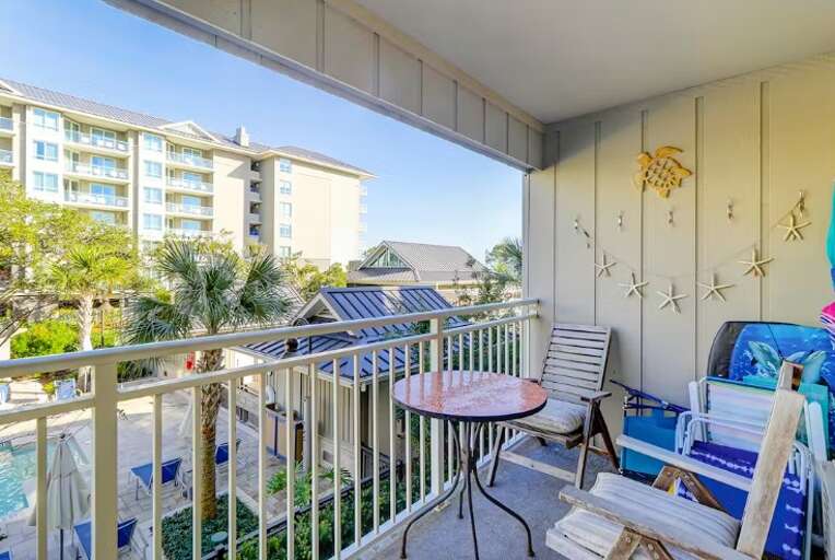 The pool visible from the balcony is the neighboring Hilton Ocean Oak pools, not the Ocean Dunes pool.