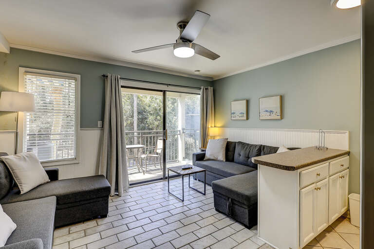 Vacation Rental View Embracing Balcony Breeze, Light Living Space Leading Leisurely To Outdoor Area