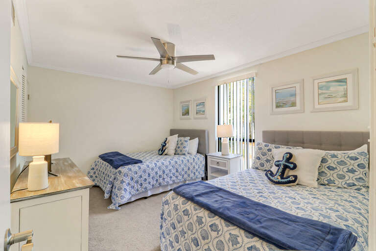 Guest Bed features two full size beds, a dresser and closet great for storage and a t.v. perfect for ending a cozy day at the beach.
