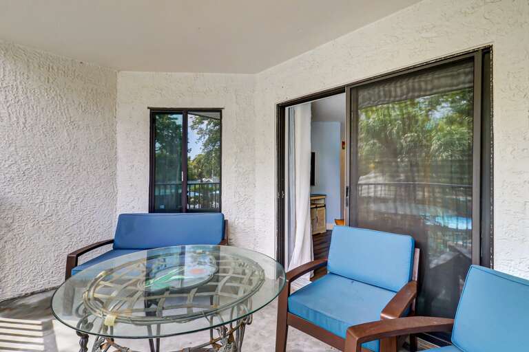 The balcony has comfortable seating for three.