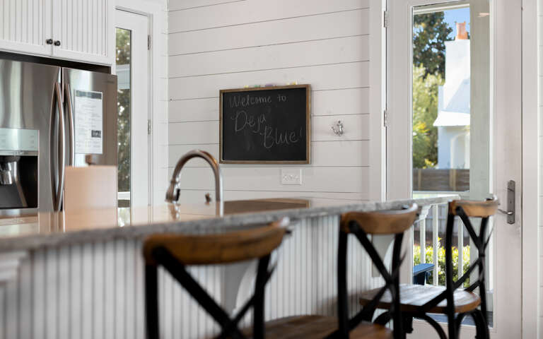 Your bright kitchen welcomes you with modern appliances, granite counters, and charming farmhouse touches for comfortable meal prep.