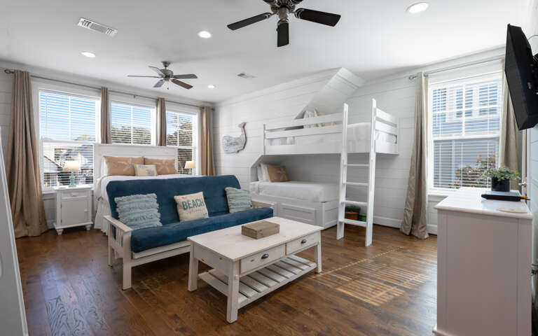 Your bright studio combines comfort and function with bunk beds, a cozy futon, and stunning city views from multiple windows.