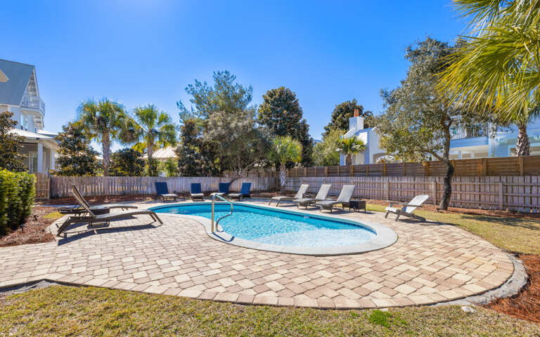 Dive into your private oasis surrounded by swaying palms and sunshine. Lounge poolside while tropical breezes carry your worries away in this fenced backyard paradise.