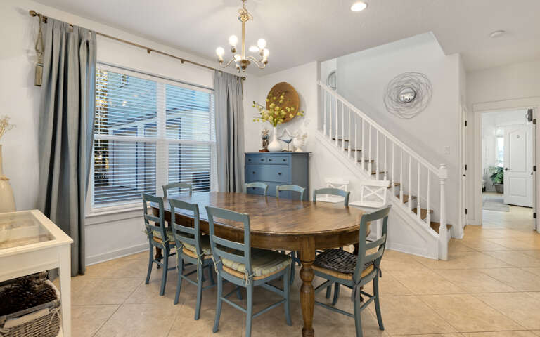 Gather around your spacious dining table for memorable meals with family and friends in this bright, welcoming space.
