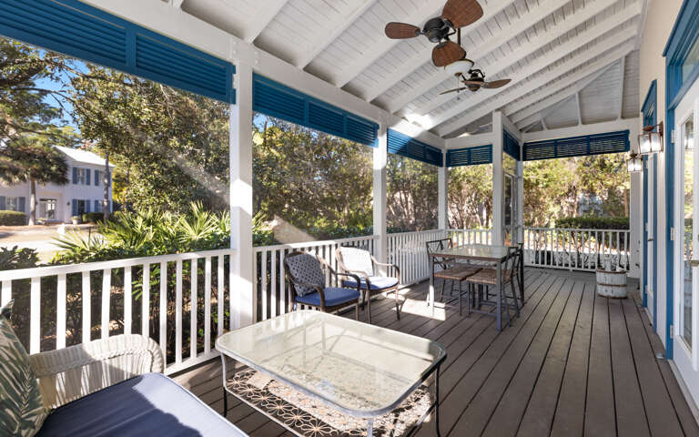 Step onto your covered porch where ceiling fans keep you cool while you enjoy morning coffee or evening cocktails with garden views.