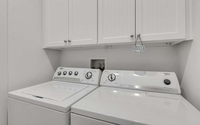 Your own laundry room keeps your clothes fresh throughout your stay, with convenient storage above for supplies.