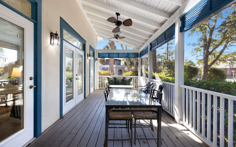 Unwind on your private covered porch where ceiling fans keep you cool while you dine al fresco surrounded by charming neighborhood views.