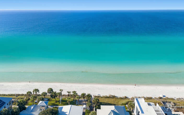 Breathtaking Gulf Coast paradise with pristine white sand beach and crystal-clear turquoise waters stretching endlessly to the horizon.
