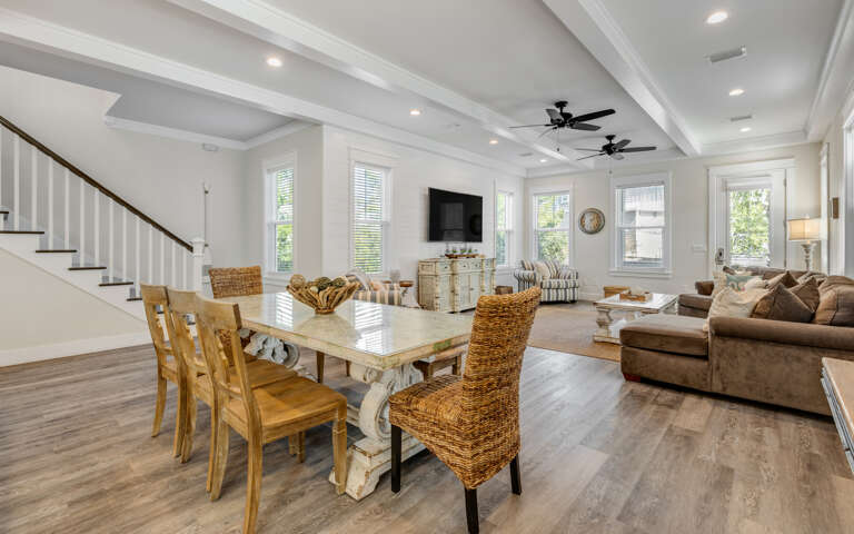 Unwind in this stunning open-concept space where exposed beams meet coastal charm, perfect for your group gatherings.