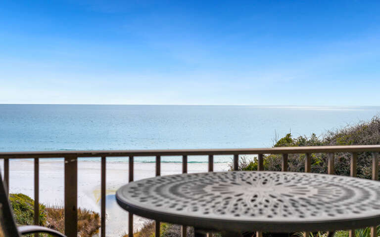 Gulf front balcony with stunning ocean views and pristine sandy shores just steps away.