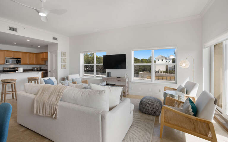 Sink into plush seating while enjoying your favorite shows on the wall-mounted TV in this bright, open living space.