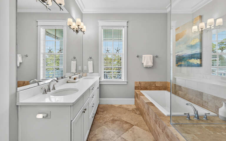 Unwind in your spa-like ensuite with dual vanities, soaking tub, and walk-in shower—perfect for relaxing after exploring.