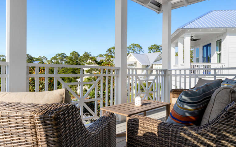 Balcony With Wicker Furniture And Scenic View Balcony With Wicker Furniture And Scenic View