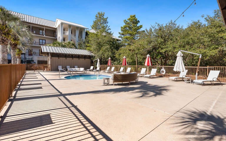 Soak up the sun by the pool, surrounded by lush greenery and comfortable loungers for the perfect relaxation retreat.