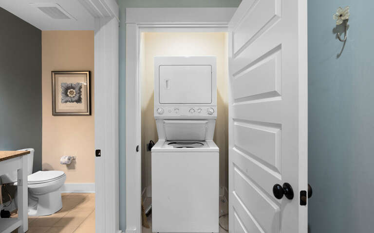 Your in-unit washer and dryer make extended stays effortless, tucked conveniently in a dedicated closet next to the bathroom.