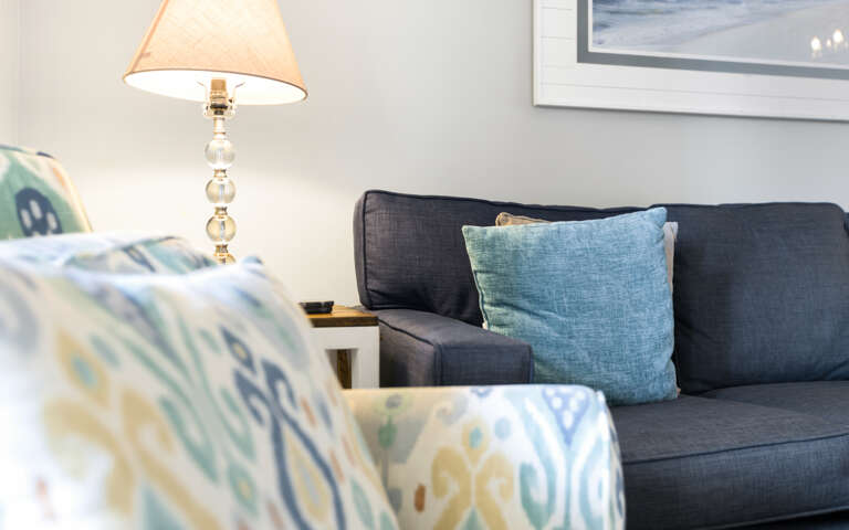 Living Room With Sofa And Patterned Armchair