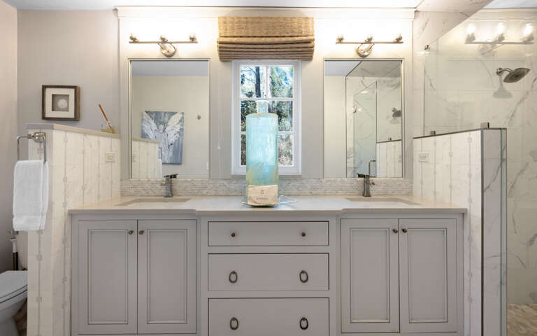 Refresh in your elegant marble bathroom with dual vanities, rainfall shower, and spa-like serenity.