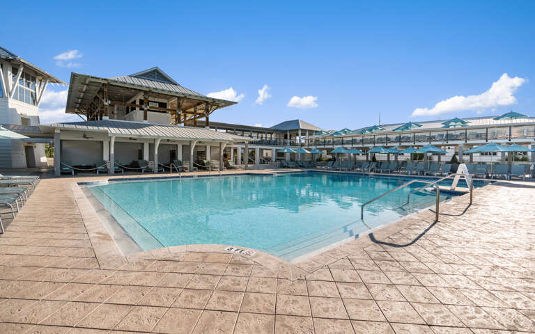 Dive into crystal-clear waters at this stunning pool surrounded by modern architecture and mountain views.