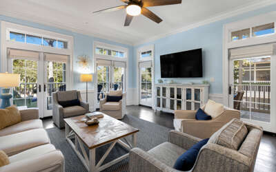 Unwind in your bright, airy living room with French doors opening to private balconies and comfortable seating for memorable moments.