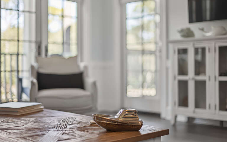 Unwind in your bright, airy living space where natural light streams through elegant windows, creating the perfect atmosphere for relaxation.