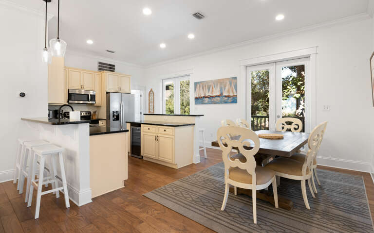 Your spacious open kitchen flows seamlessly into the dining area, where you'll love preparing meals and gathering around the elegant table.