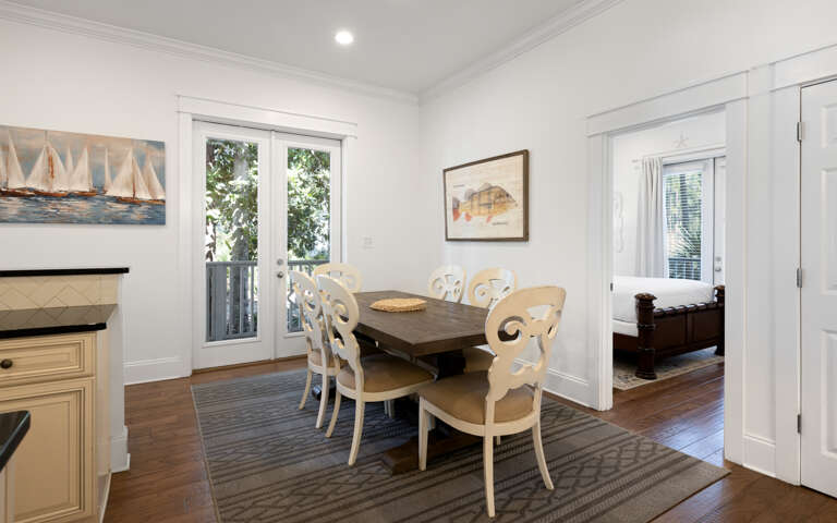 Gather around this elegant dining table where coastal charm meets comfort, perfect for sharing meals and making memories.