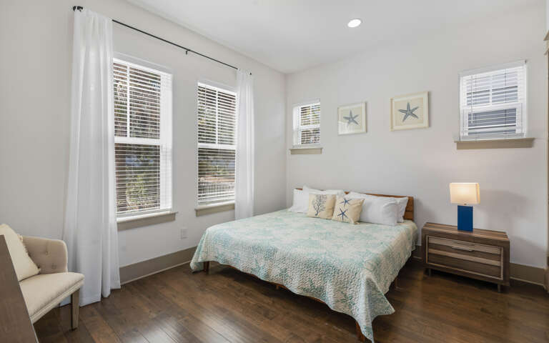 Drift off to sleep in your serene bedroom where coastal-inspired linens and nautical art create a peaceful retreat.