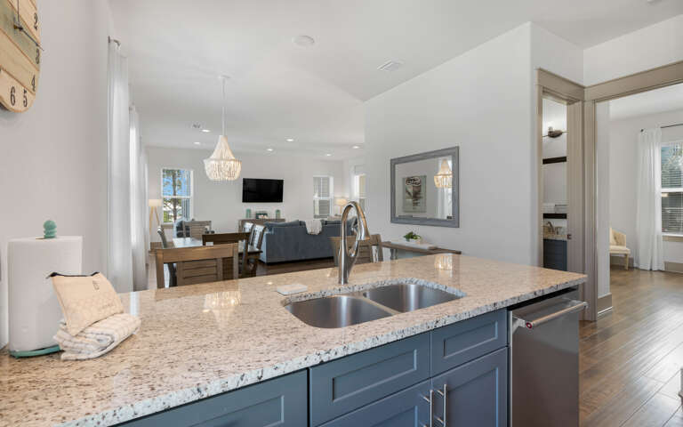 Your modern kitchen island flows seamlessly into the elegant living area, creating the perfect space for cooking and entertaining.