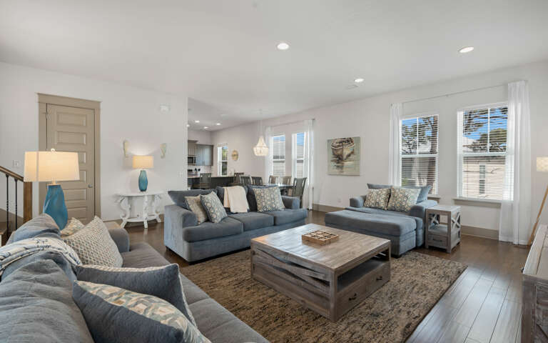 Sink into plush coastal comfort in this bright living space, where soft blue tones and natural textures create your perfect relaxation retreat.