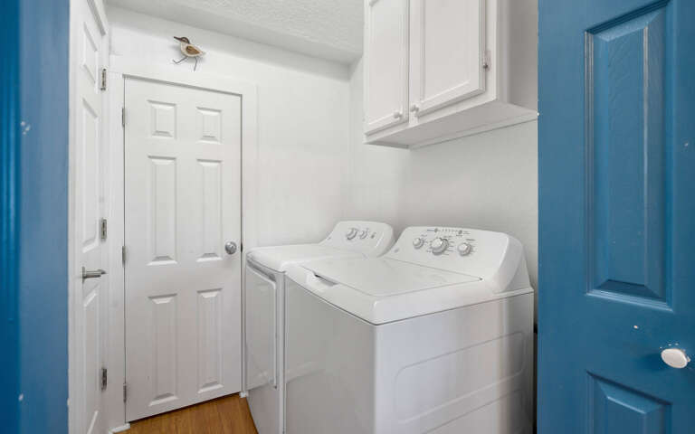 Your dedicated laundry room features full-size washer and dryer with convenient overhead storage for all your vacation essentials.