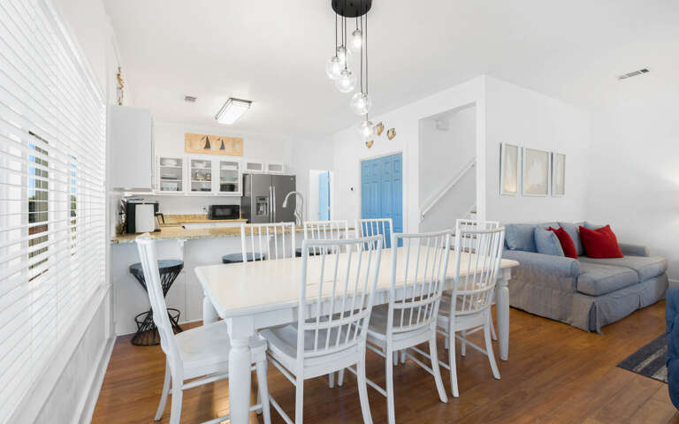 Relax in this bright, open-plan living space where you can cook, dine and unwind together under stylish pendant lights.