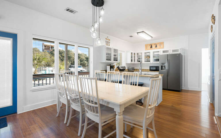 Your spacious dining area opens to a fully equipped kitchen, perfect for family gatherings and meal prep.
