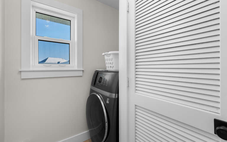 Keep your clothes fresh with your own private washer and dryer, tucked away in this convenient laundry closet for easy access.