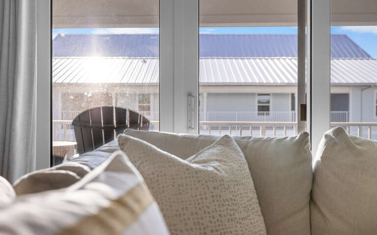 Sink into plush pillows and watch the world go by through your bright window - the perfect spot for morning coffee or quiet moments.