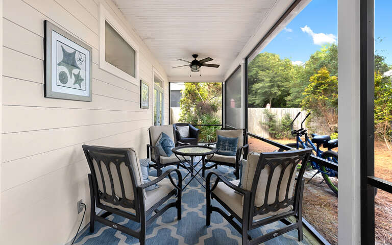 Covered Porch With Seating Area And Bicycles