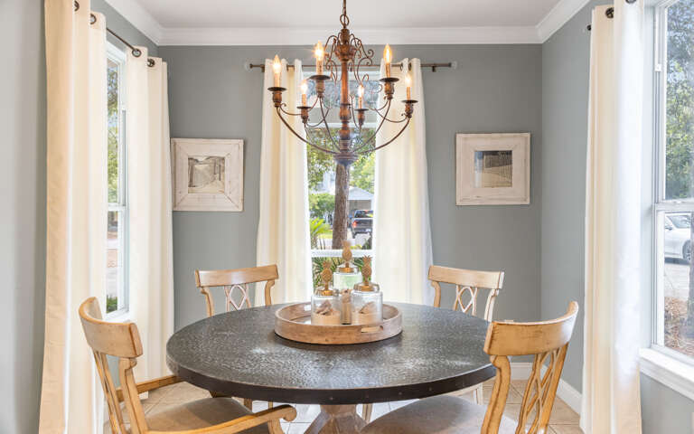 Dining Area In Vacation Rental With Round Table And Chairs