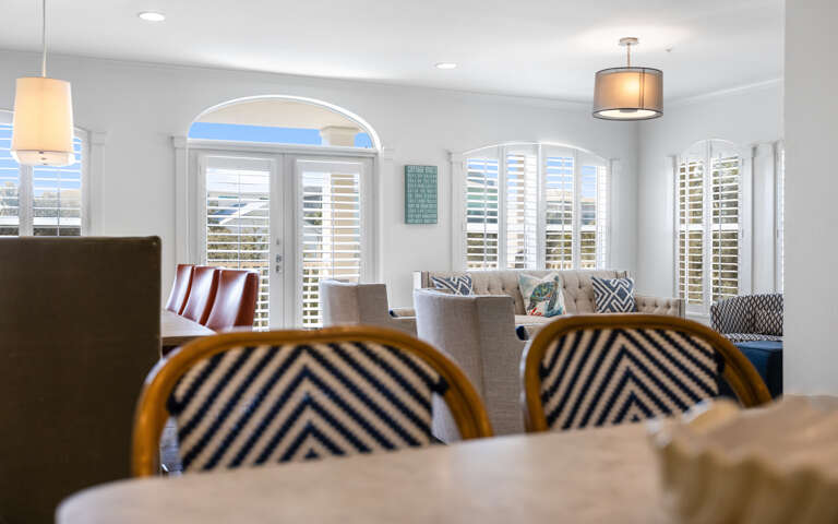Relax in your beautifully appointed living space where comfortable seating and coastal-inspired decor create the perfect retreat.