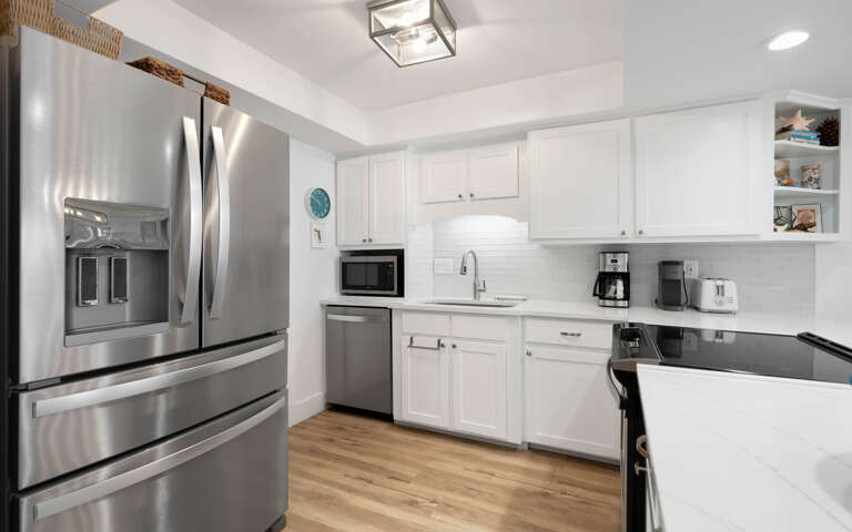Cook effortlessly in your fully equipped kitchen with stainless steel appliances, granite counters, and everything you need for memorable meals.