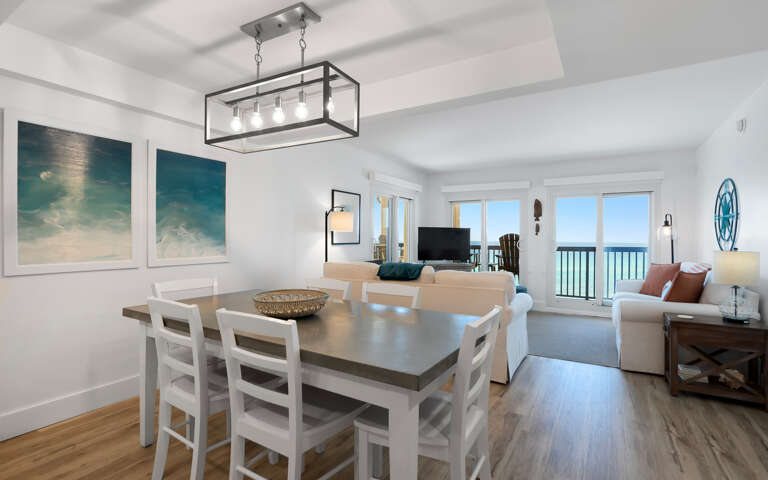Relax in your bright, coastal-inspired living space where ocean views frame every meal and the open layout flows from dining to sea.